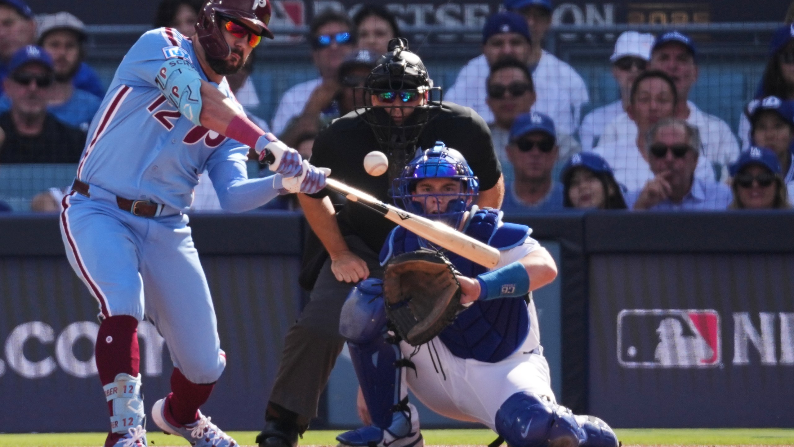 FILE - Philadelphia Phillies' Kyle Schwarber connects for a double during the first inning in Game 4 of baseball's National League Division Series against the Los Angeles Dodgers, Oct. 9, 2025, in Los Angeles. (AP Photo/Jae C. Hong, File)