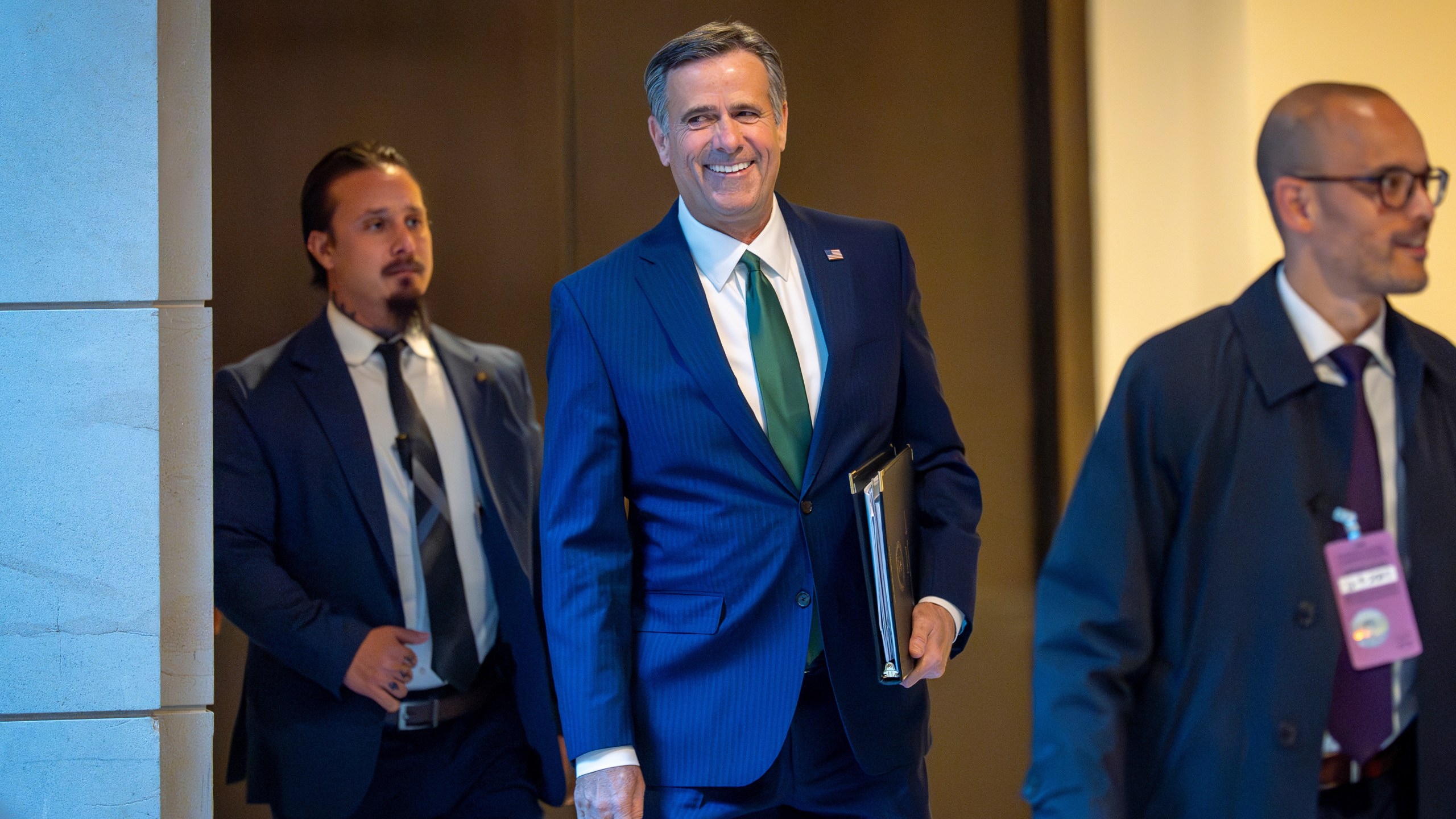 CIA Director John Ratcliffe walks to a secure room in the basement of the Capitol to join Defense Secretary Pete Hegseth to brief lawmakers on how he handled a military strike on a suspected drug smuggling boat and its crew in the Caribbean near Venezuela Sept. 2, in Washington, Tuesday, Dec. 9, 2025. (AP Photo/J. Scott Applewhite)