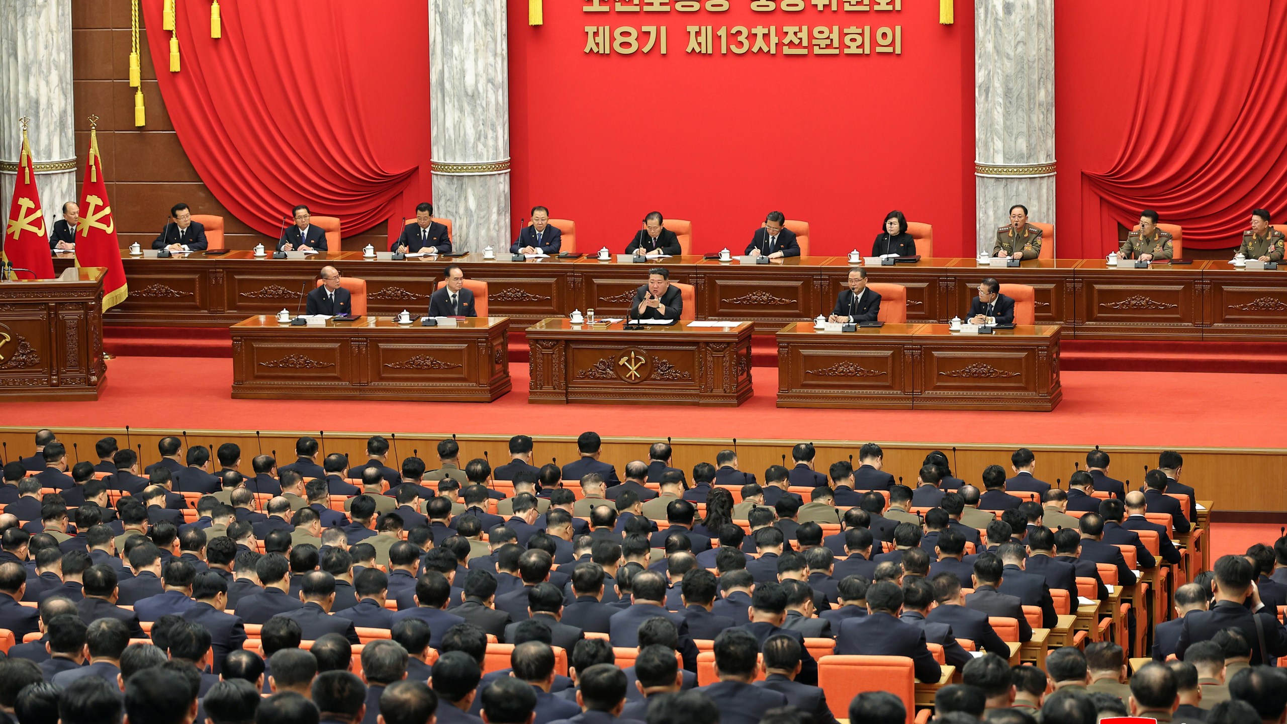 In this photo provided by the North Korean government, North Korean leader Kim Jong Un, center, attends a plenary meeting of the Workers Party's Central Committee in North Korea, Tuesday, Dec. 9, 2025. Independent journalists were not given access to cover the event depicted in this image distributed by the North Korean government. The content of this image is as provided and cannot be independently verified. Korean language watermark on image as provided by source reads: "KCNA" which is the abbreviation for Korean Central News Agency. (Korean Central News Agency/Korea News Service via AP)