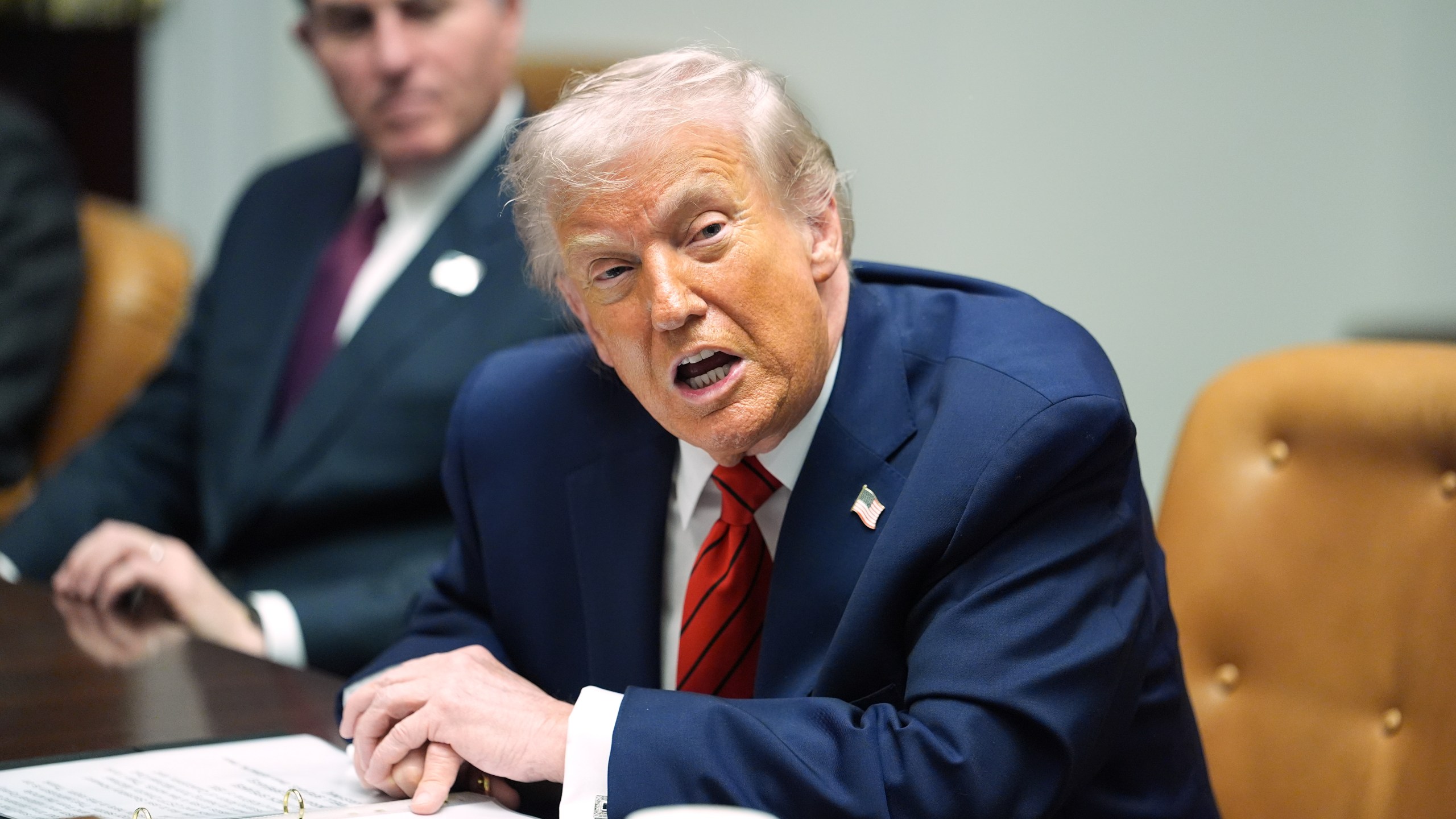 Sitting next to founder and CEO of Dell, Michael Dell, left, President Donald Trump speaks during a roundtable discussion with business leaders in the Roosevelt Room of the White House, Wednesday, Dec. 10, 2025, in Washington. (AP Photo/Evan Vucci)