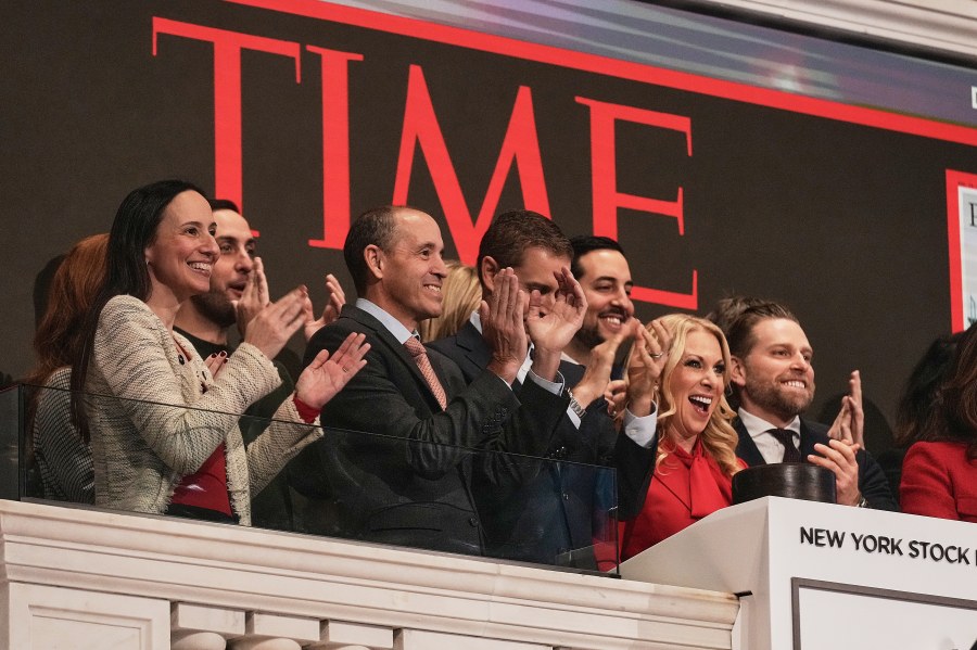 TIME CEO Jessica Sibley, second from right, joined by OpenAI Chief Global Affairs Officer Chris Lehane, second left, rings the New York Stock Exchange opening bell for TIME's "Person of the Year," Thursday, Dec. 11, 2025. (AP Photo/Richard Drew)